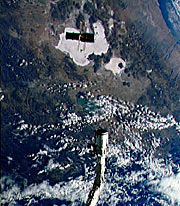 Hubble has just been released by the Shuttle's robotic arm and is slowly drifting away. Hubble has just been released by the Shuttle's robotic arm and is slowly drifting away.